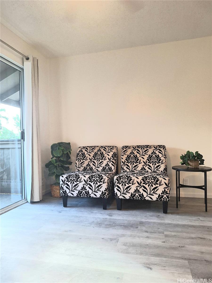 Undisclosed Address Ewa Beach, HI 96706 - Photo 7 of 11 a view of a couch in a room