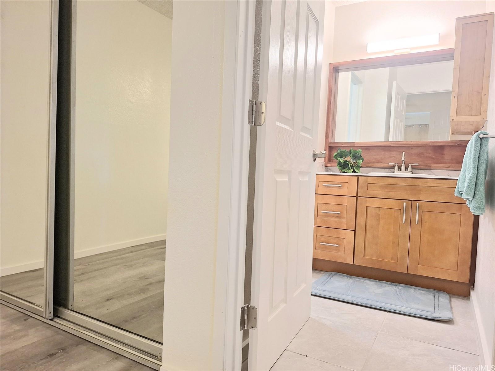 Undisclosed Address Ewa Beach, HI 96706 - Photo 9 of 11 a bathroom with a sink and a mirror
