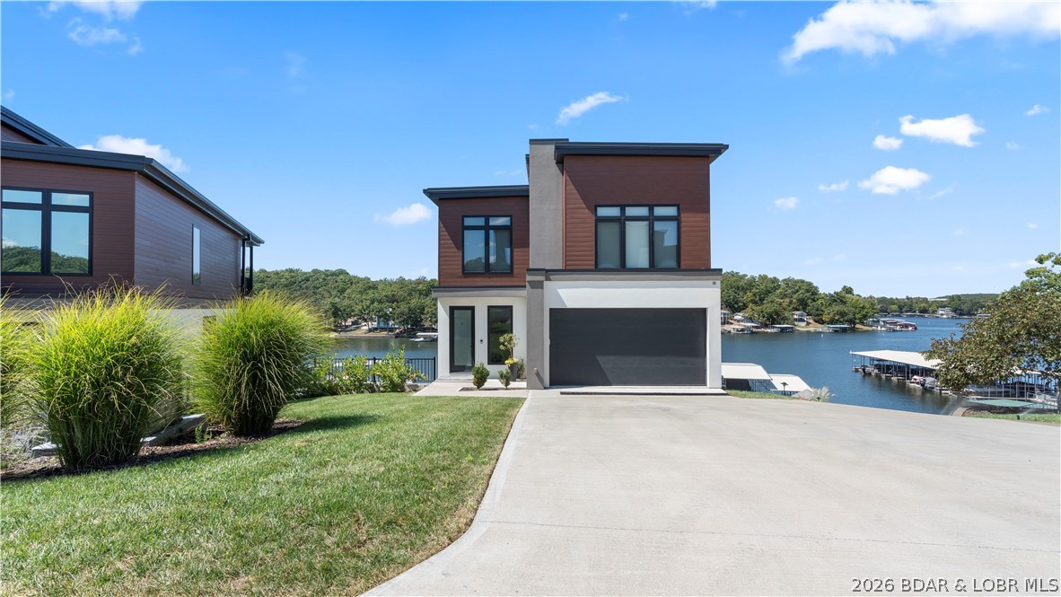 66 Daisy Road Lake Ozark, MO 65049 - Photo 3 of 51 Photo is of a completed model home with the same f