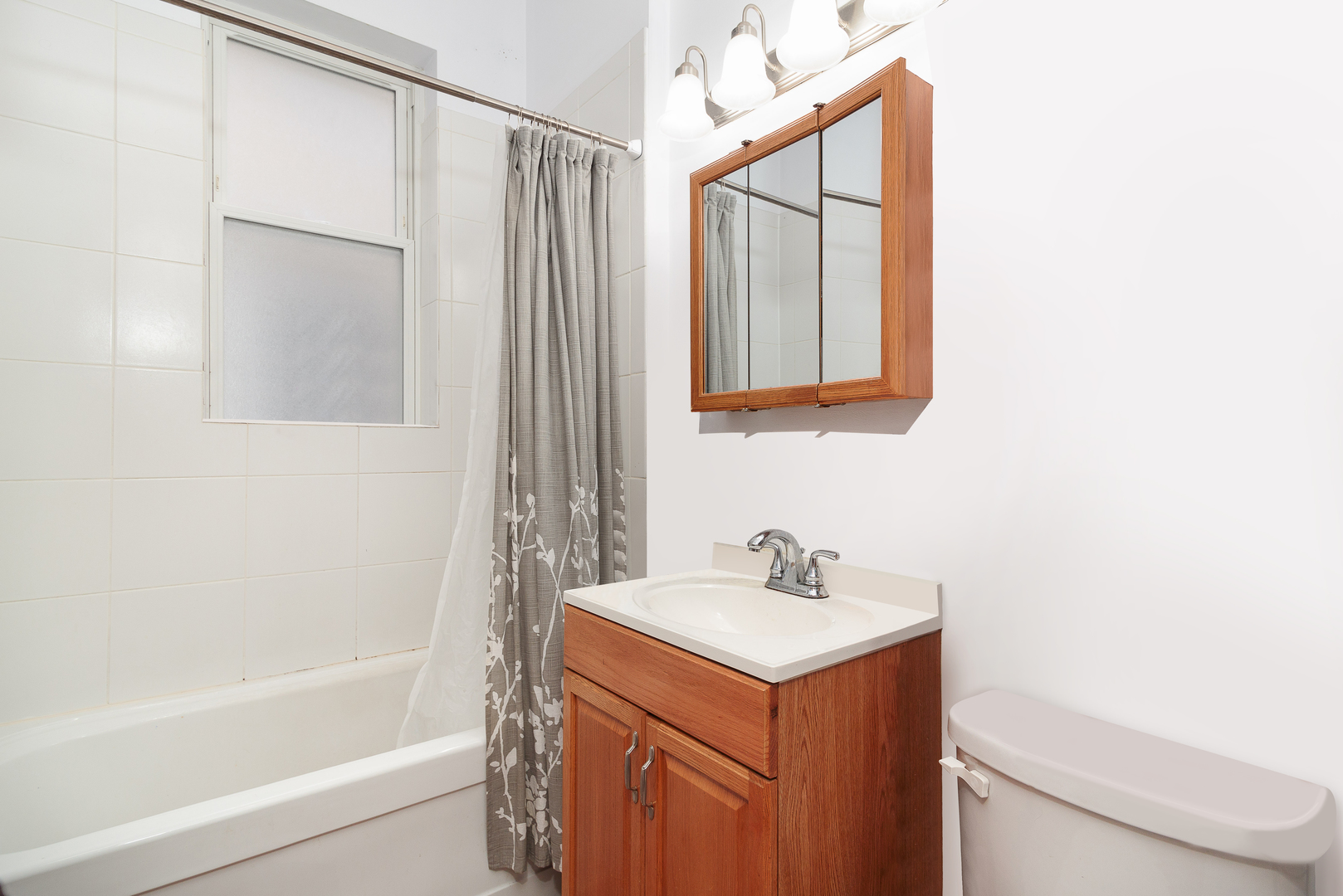 2347 West Walton Street, Unit 2 Chicago, IL 60622 - Photo 8 of 11 a bathroom with a sink a toilet and shower