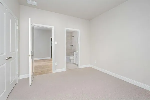 an empty room with closet area