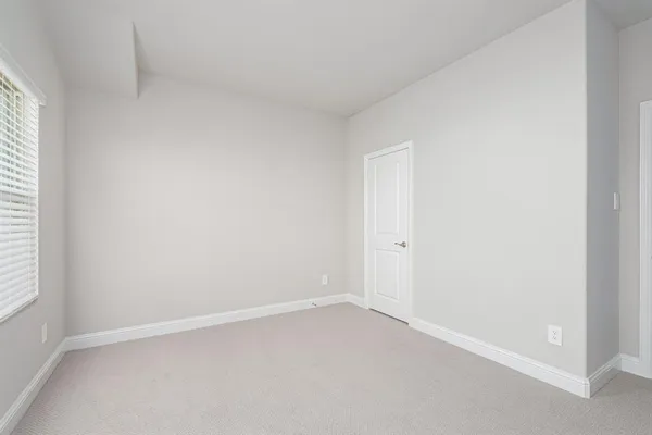 an empty room with a empty space and a window