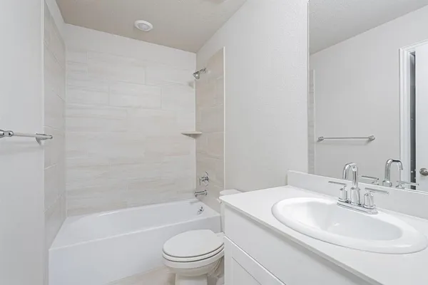 a bathroom with a toilet a sink and a bathtub
