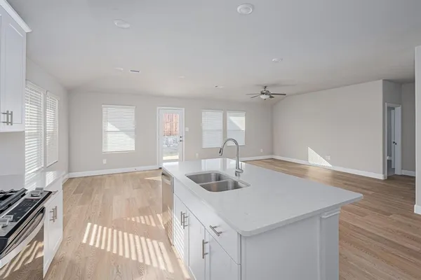 a kitchen with a sink and cabinets