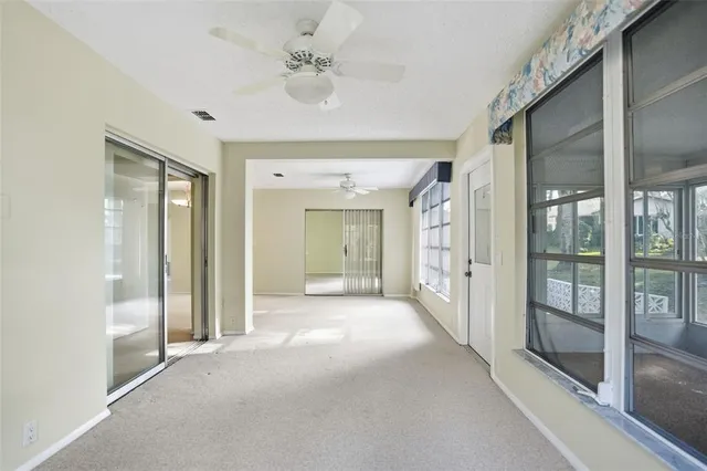 a view of a hallway with a chandelier