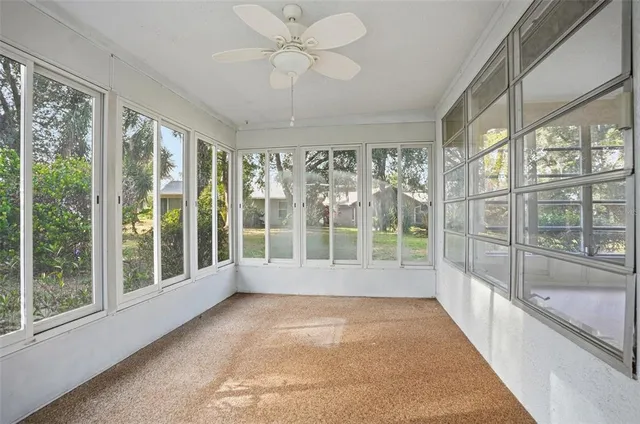 a view of hallway with windows