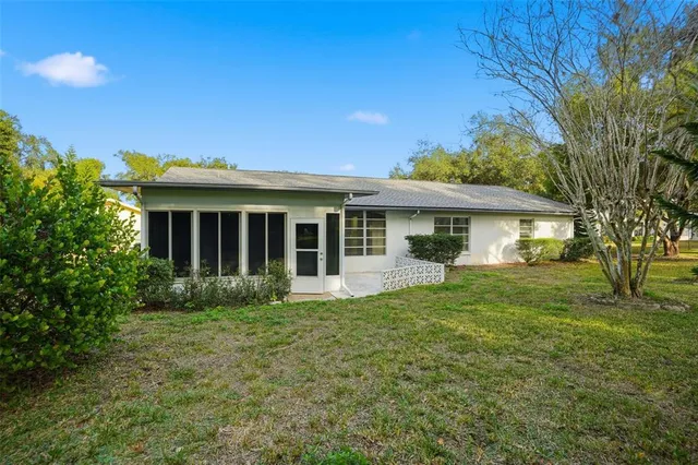 a view of a house with a back yard