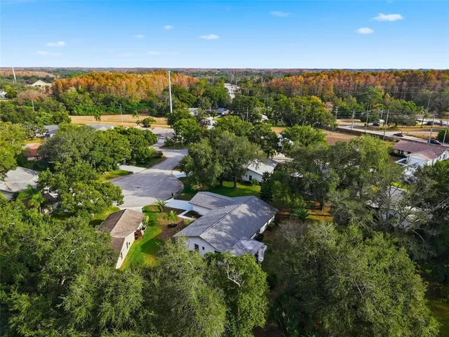 an aerial view of house with yard swimming pool and outdoor seating