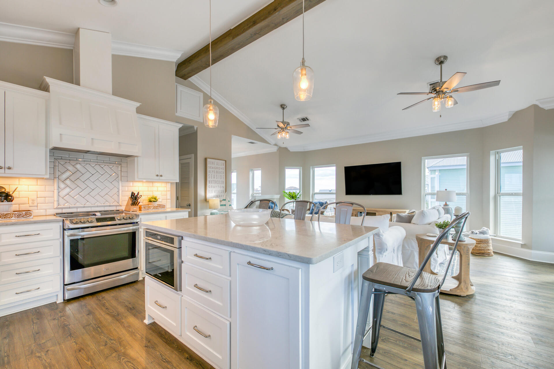 28 Sandcastle Court Santa Rosa Beach, FL 32459 - Photo 14 of 78 a kitchen with stainless steel appliances a stove a sink a dining table and chairs