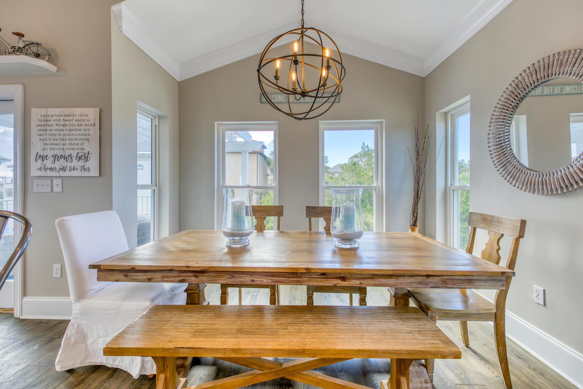 28 Sandcastle Court Santa Rosa Beach, FL 32459 - Photo 15 of 78 a view of a dining room with furniture wooden floor and a chandelier