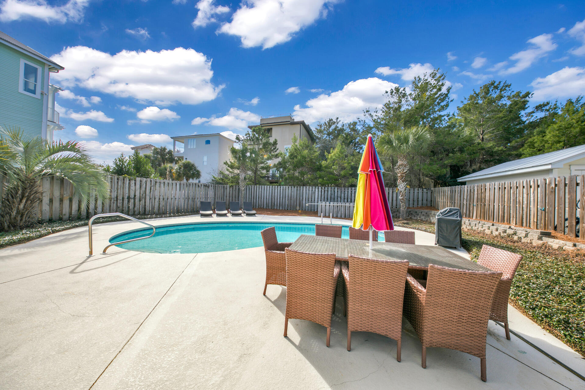 28 Sandcastle Court Santa Rosa Beach, FL 32459 - Photo 32 of 78 a view of backyard with swimming pool and outdoor seating