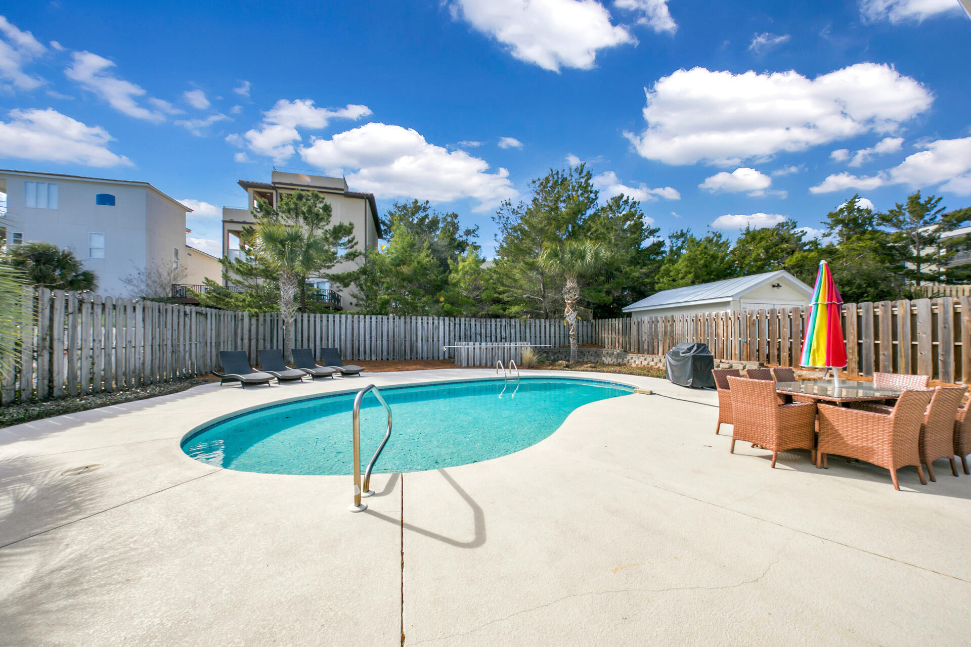 28 Sandcastle Court Santa Rosa Beach, FL 32459 - Photo 33 of 78 a view of a backyard with swimming pool and furniture