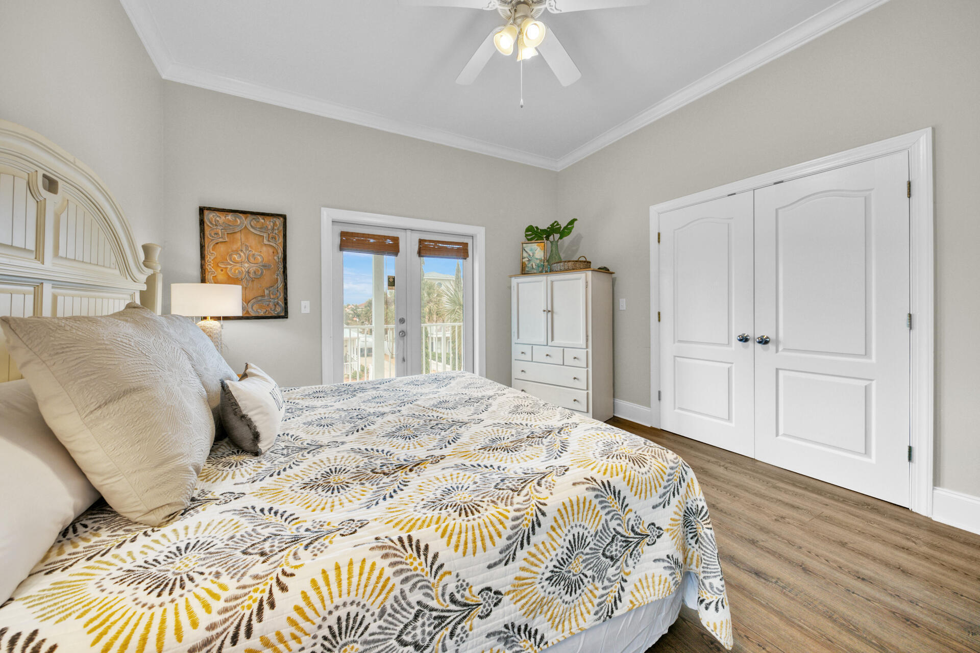 28 Sandcastle Court Santa Rosa Beach, FL 32459 - Photo 39 of 78 a bedroom with a large bed and a chandelier