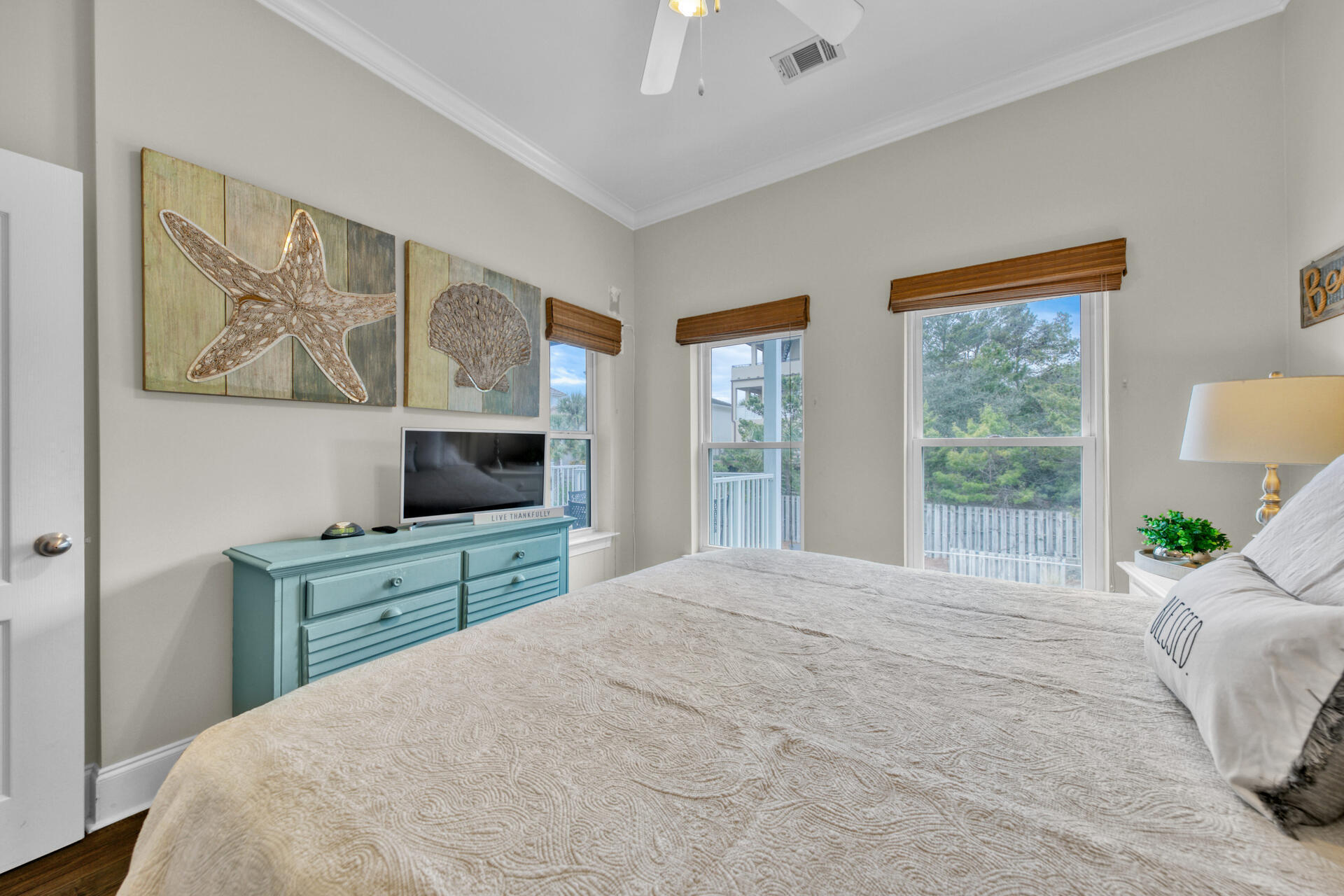 28 Sandcastle Court Santa Rosa Beach, FL 32459 - Photo 44 of 78 a bedroom with a large bed and a flat tv screen on dresser
