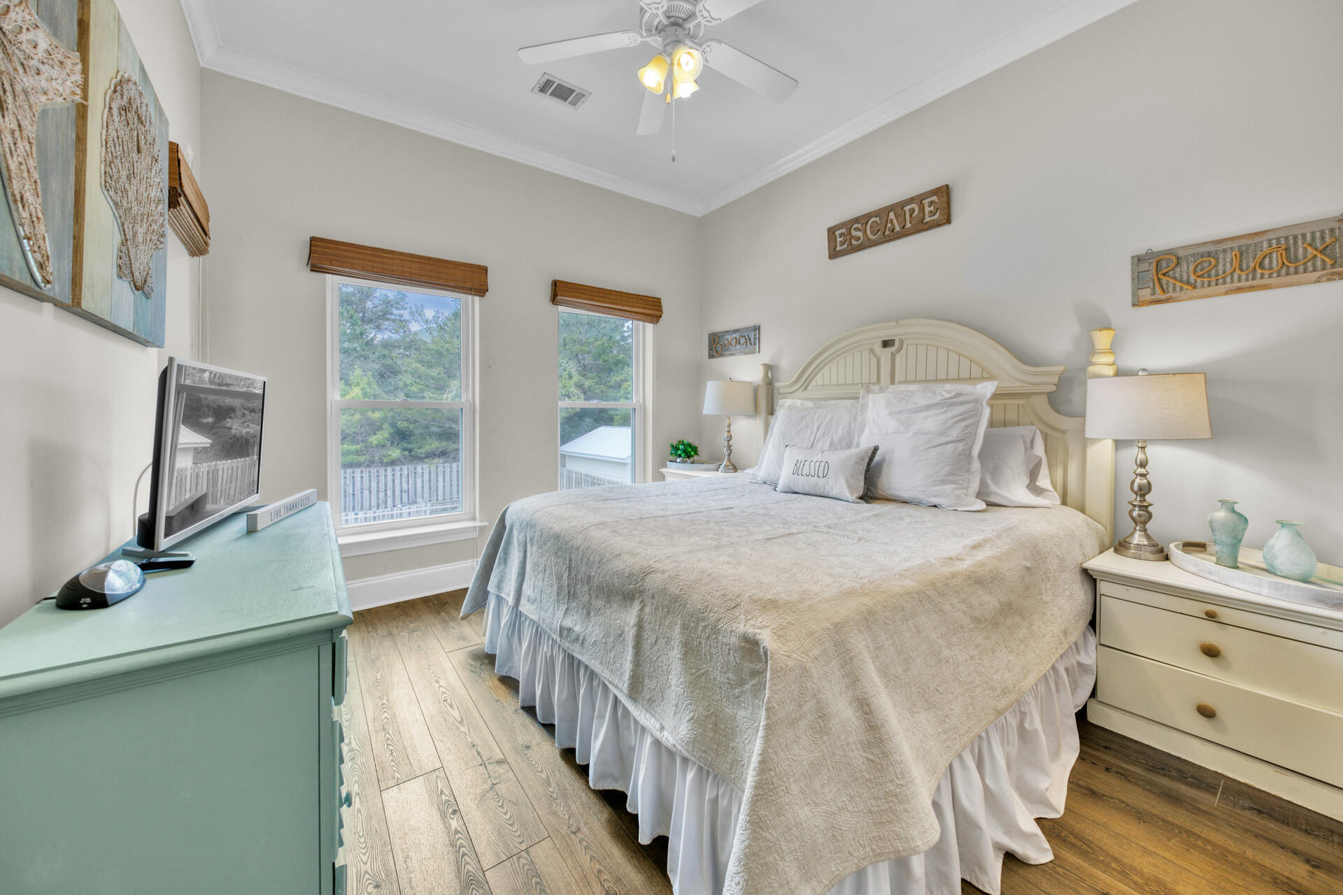 28 Sandcastle Court Santa Rosa Beach, FL 32459 - Photo 45 of 78 a bedroom with a bed and a flat tv screen on dresser