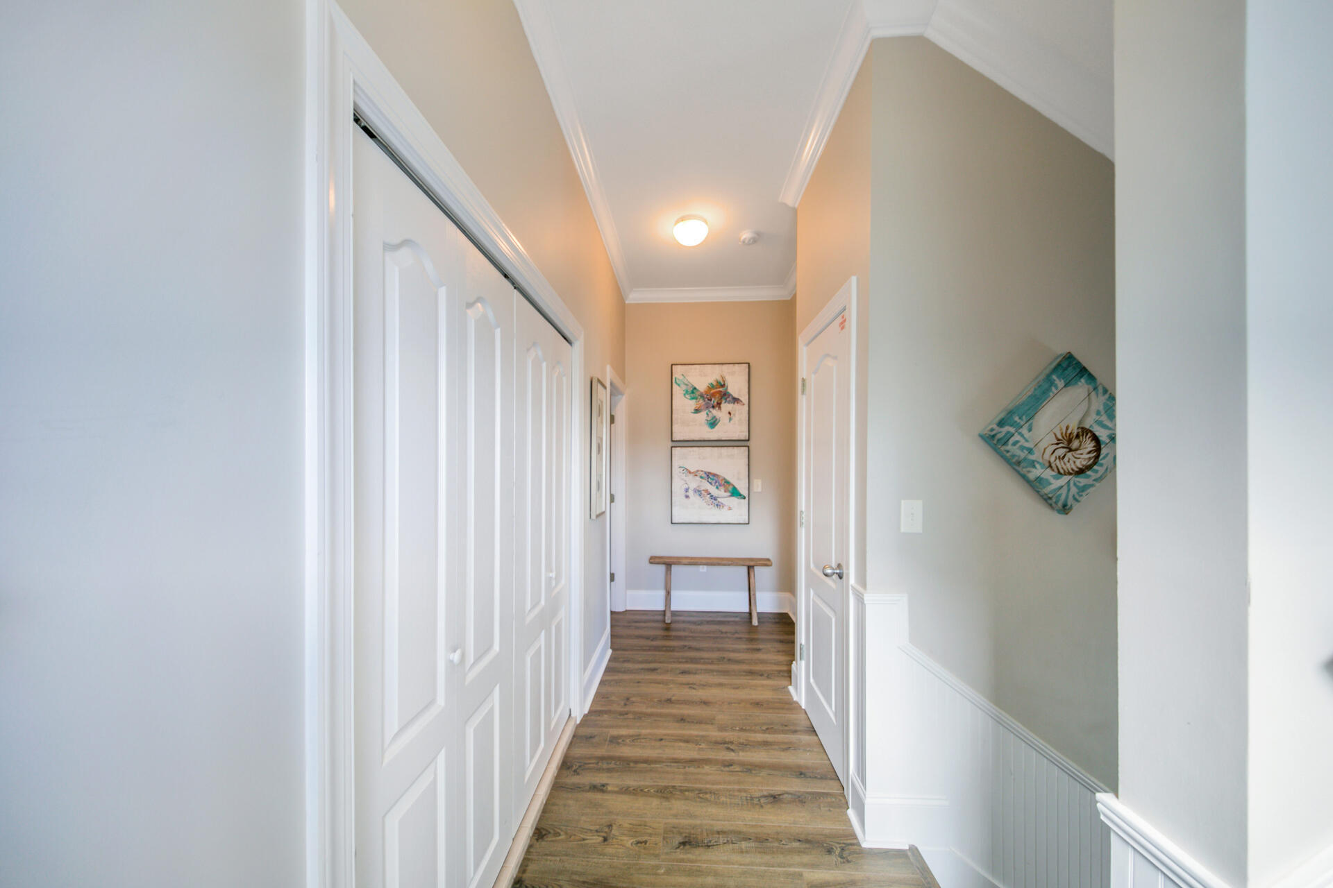 28 Sandcastle Court Santa Rosa Beach, FL 32459 - Photo 50 of 78 a view of a hallway with wooden floor and staircase