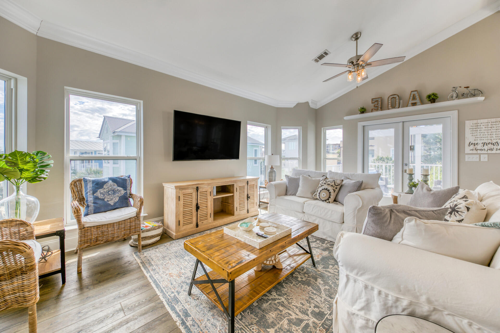 28 Sandcastle Court Santa Rosa Beach, FL 32459 - Photo 9 of 78 a living room with furniture a fireplace and a flat screen tv