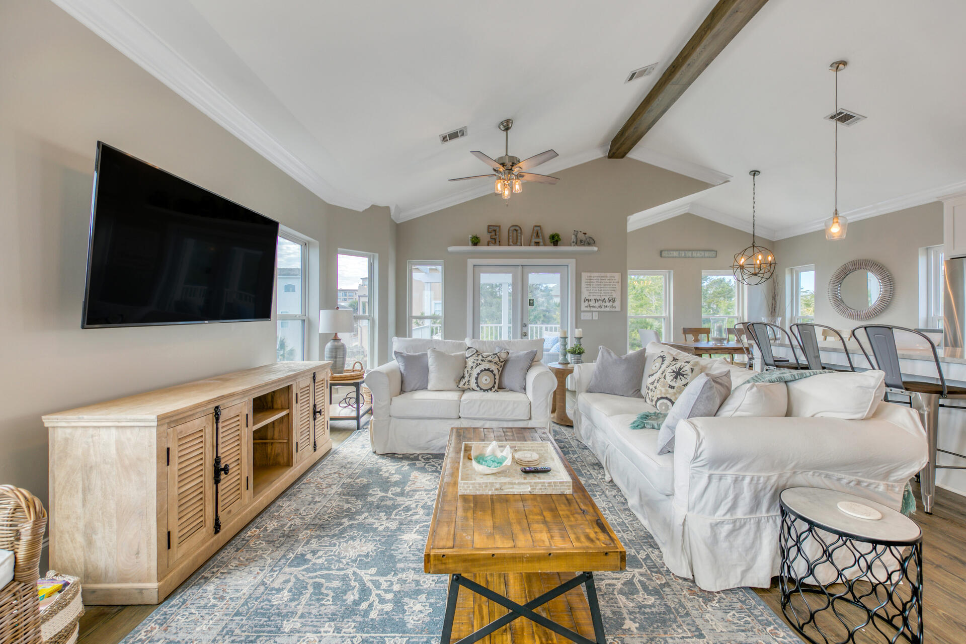 28 Sandcastle Court Santa Rosa Beach, FL 32459 - Photo 10 of 78 a large living room with a flat screen tv