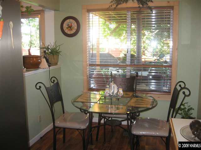 1140 Big Springs Road Reno, NV 89523 - Photo 3 of 9 a view of a dining room with furniture window and outside view