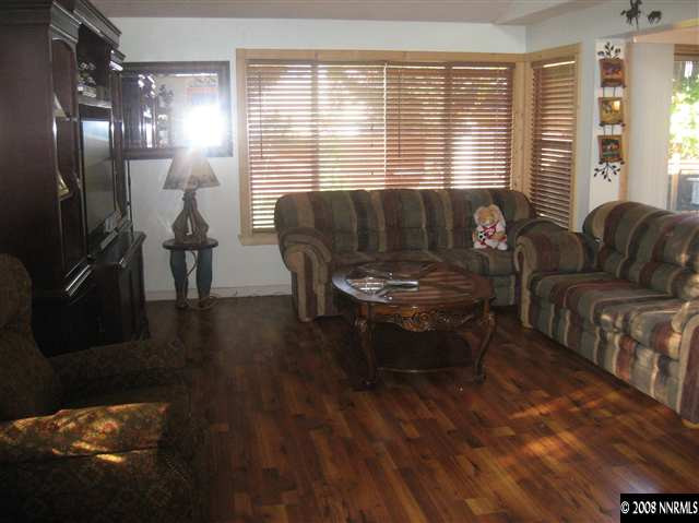 1140 Big Springs Road Reno, NV 89523 - Photo 5 of 9 a living room with furniture and wooden floor