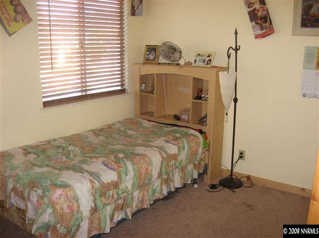 1140 Big Springs Road Reno, NV 89523 - Photo 8 of 9 a bedroom with a bed and a window