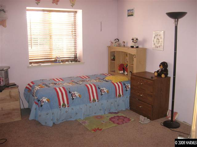1140 Big Springs Road Reno, NV 89523 - Photo 9 of 9 a bed room with a bed and a window