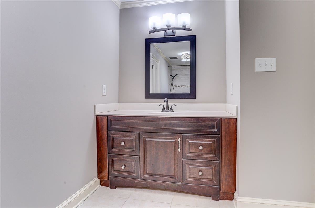 608 Roxburgh Drive Collierville, TN 38017 - Photo 25 of 40 Bathroom with vanity, crown molding, and light tile patterned floors