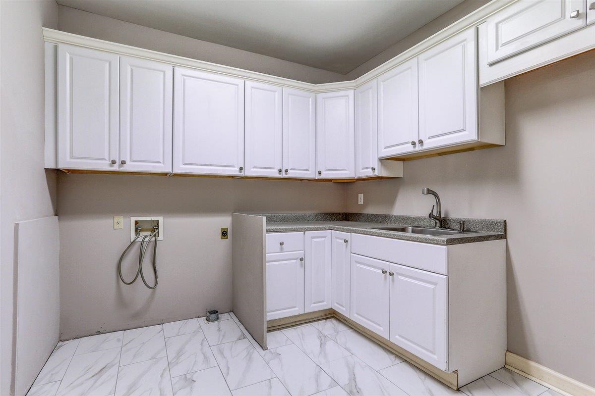 608 Roxburgh Drive Collierville, TN 38017 - Photo 26 of 40 Washroom with washer hookup, light marble finish flooring, and cabinet space