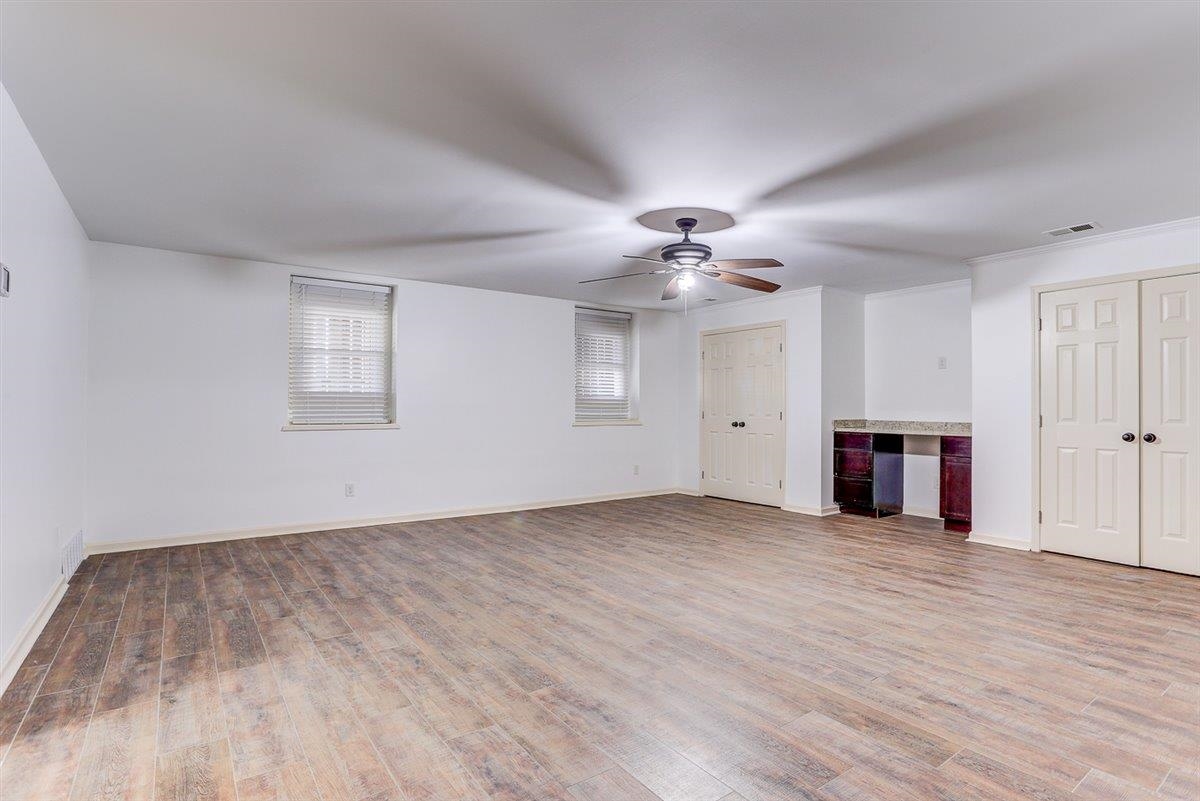 608 Roxburgh Drive Collierville, TN 38017 - Photo 38 of 40 Unfurnished living room with light wood-style floors and a ceiling fan