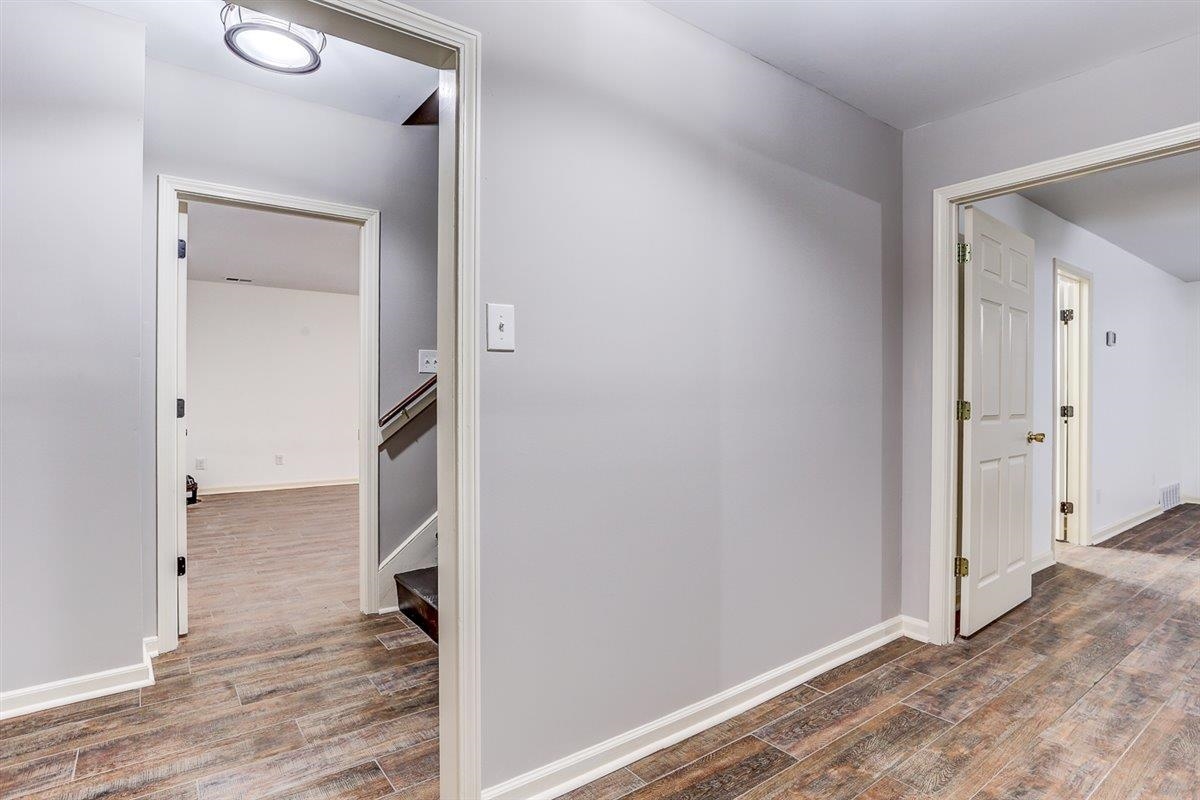608 Roxburgh Drive Collierville, TN 38017 - Photo 39 of 40 Corridor featuring dark wood-style flooring
