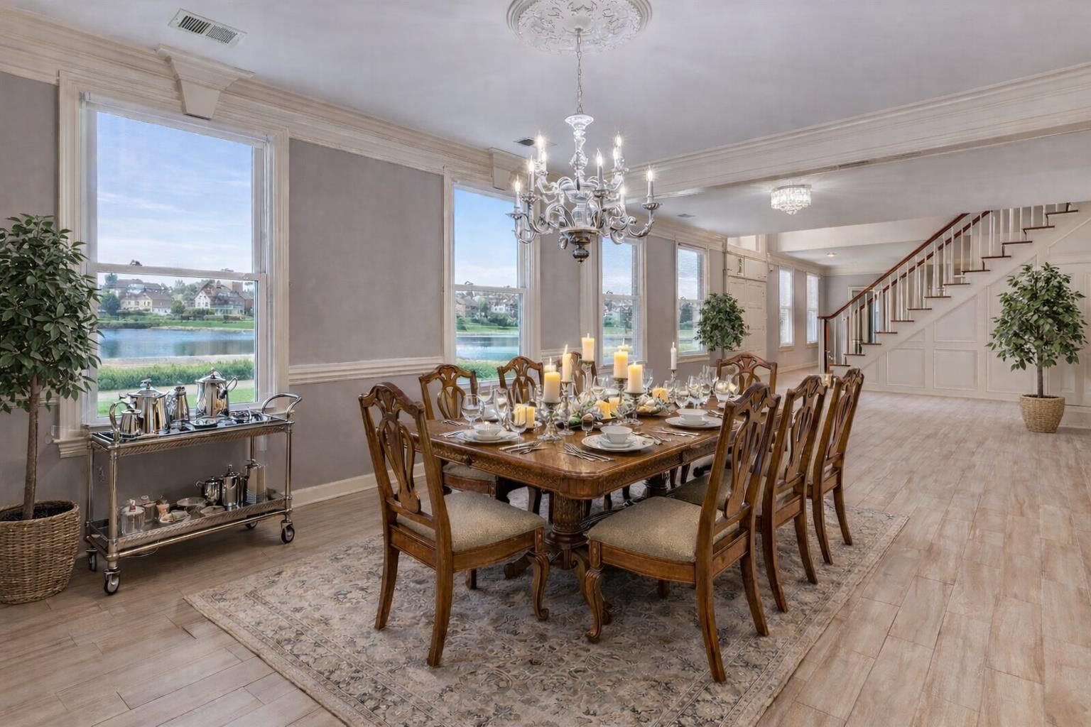 608 Roxburgh Drive Collierville, TN 38017 - Photo 6 of 40 Dining area with light wood-type flooring, a chandelier, and a water view