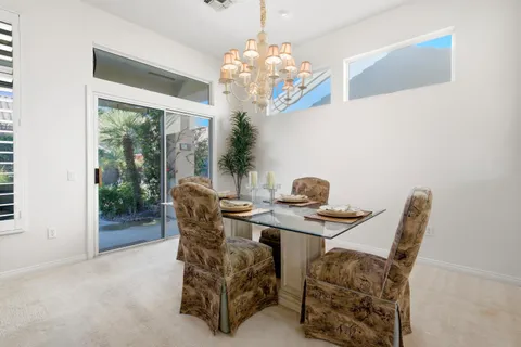 a work room with furniture and a large window