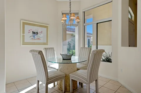 a spacious bedroom with a bed and a large window