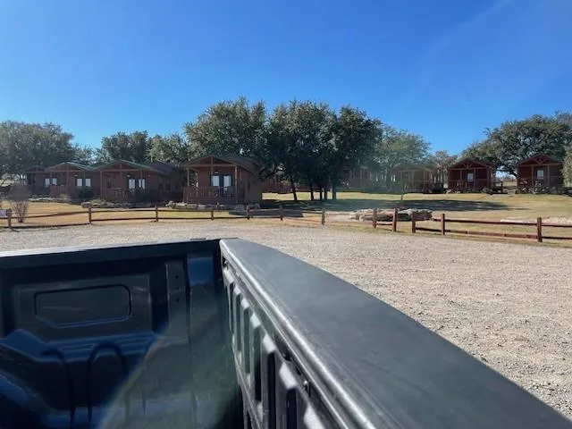 a view of outdoor space with garden and lots of trees
