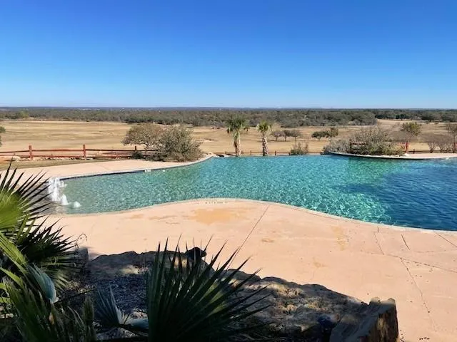 a view of a yard with an ocean view