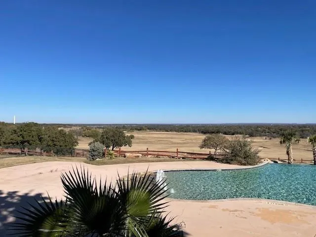 a view of a lake with a yard