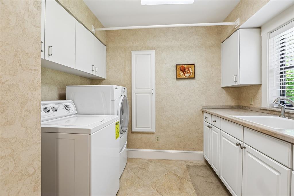 17810 Crawley Road Odessa, FL 33556 - Photo 22 of 76 a utility room with washer and dryer