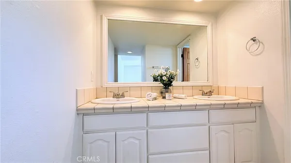 a white toilet sitting next to a bath tub