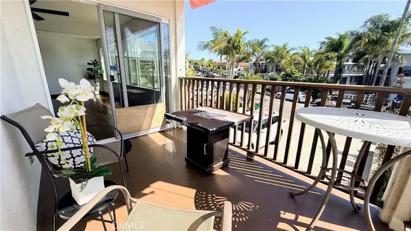 a view of a balcony with chairs