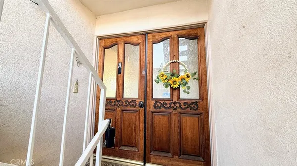 a view of an entryway with wooden floor