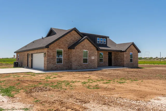 a living room with furniture and view of kitchen