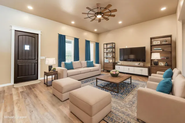 a large white kitchen with stainless steel appliances