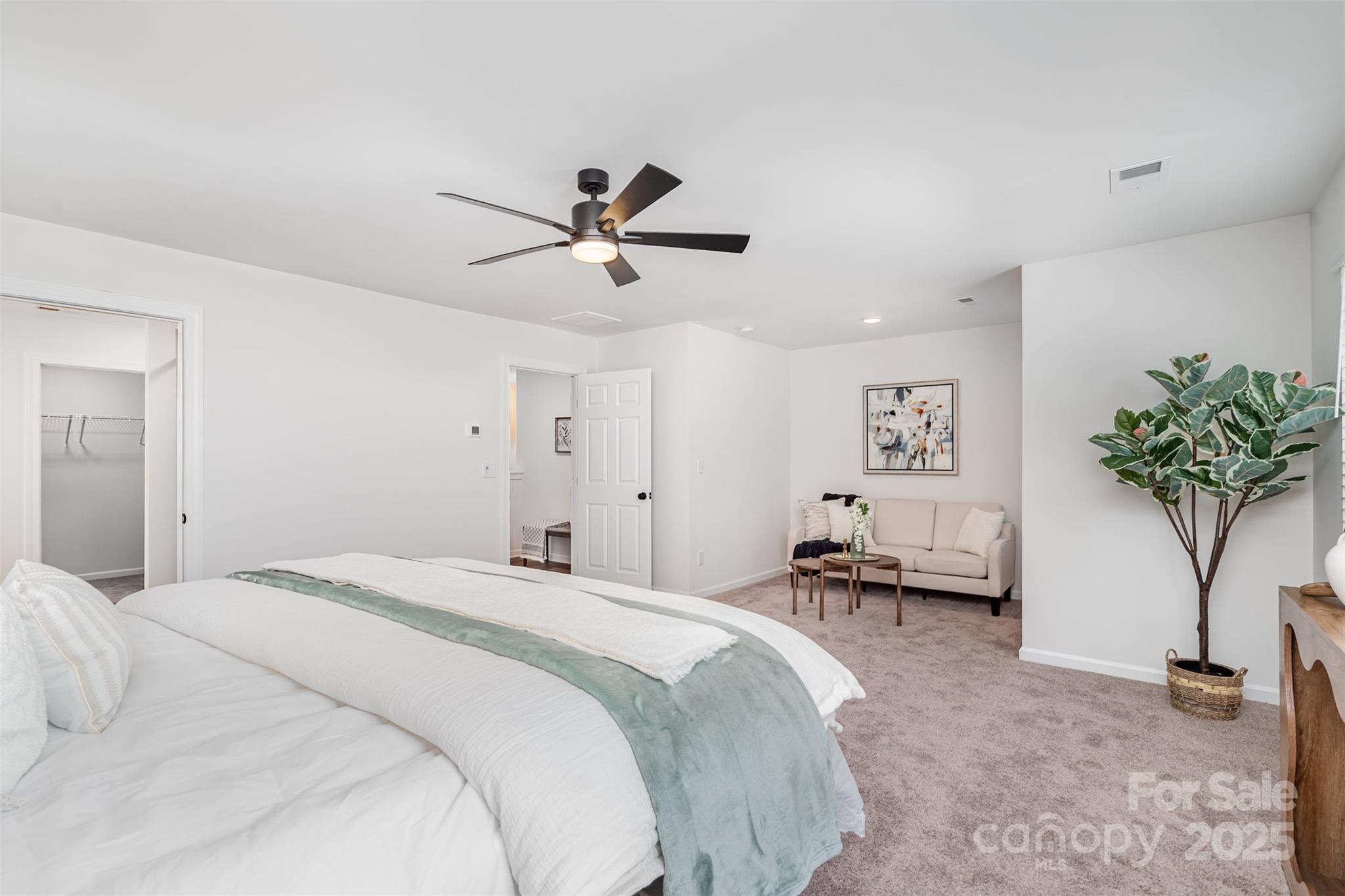 1563 Riverview Circle Fort Lawn, SC 29714 - Photo 13 of 27 a bedroom with a bed and a potted plant