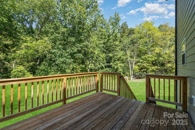 a view of balcony with wooden floor