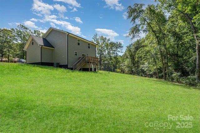 a backyard of a house with lots of green space