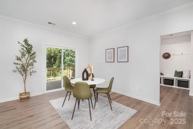 a view of a livingroom with furniture and a potted plant