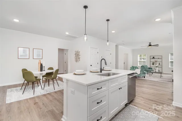 a view of dining table chairs and entryway
