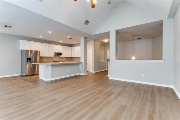 a view of kitchen with wooden floor