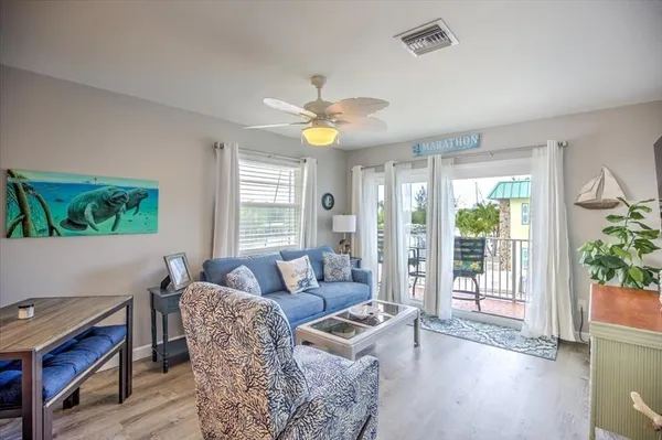 a living room with furniture and a window
