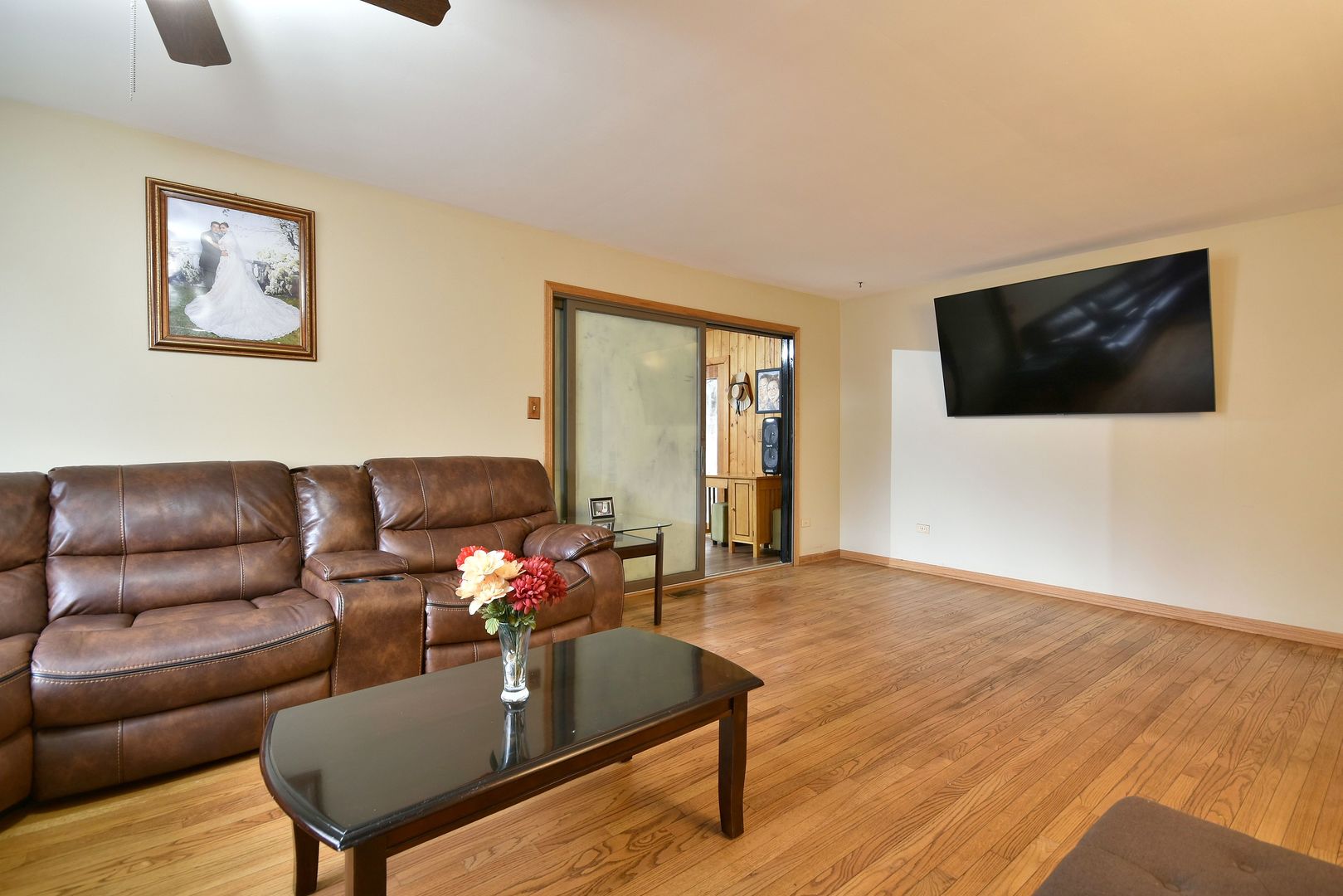 9N590 Flora Drive Elgin, IL 60123 - Photo 13 of 31 a living room with furniture and a flat screen tv